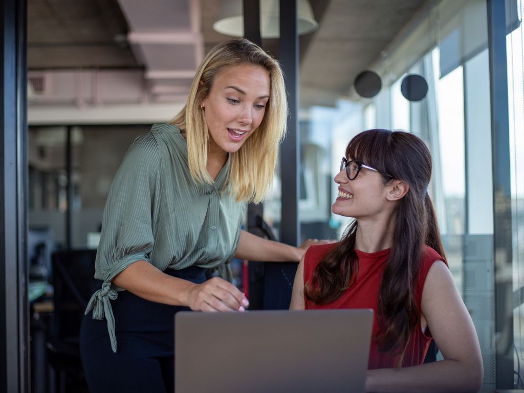Growth-Oriented Development Ideas For Your Employees 1 A female manager providing feedback to a female employee