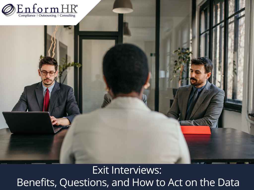 Two HR professionals conducting an exit interview in an office setting